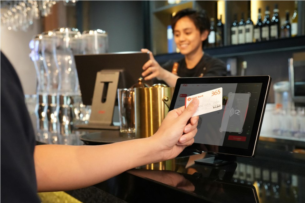 Bartender with card payment terminal